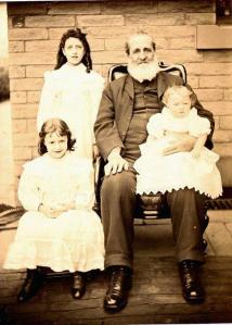 Philip Henry Ely with Margaret Ely on lap Who are the other 2